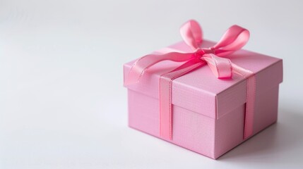 Obraz premium Pink Gift Box Used During Christmas, Set Against A White Background, Creating A Festive Atmosphere.