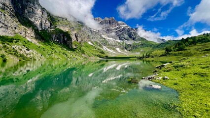 Obraz premium mountain lake in swiss alps in front of mount glärnisch