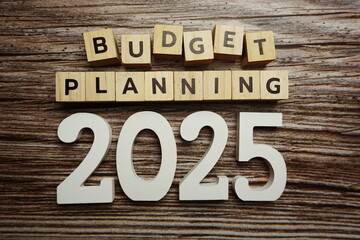 Budget Planning 2025 alphabet letters on wooden background