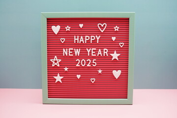 Happy New Year 2025 alphabet letters on pink and blue background