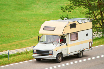 Retro camper on holiday near green park road