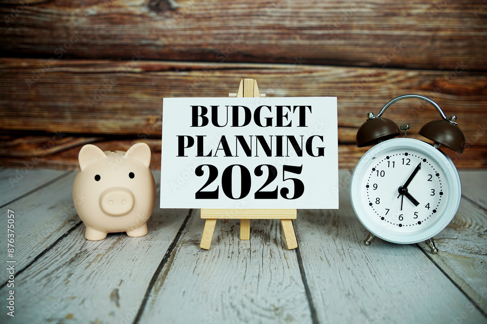 Poster budget planning 2025 text message with alarm clock and piggy saving on wooden background