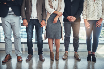 Business people, closeup and legs with footwear, shoes and creative agency for cooperation. Feet, patience and employees in workplace, collaboration and style with teamwork, fashion and group waiting