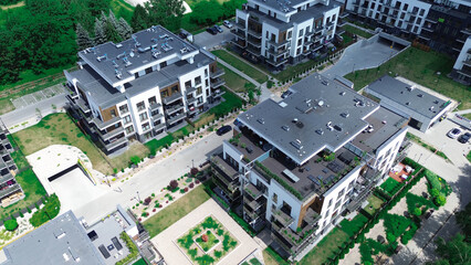 Modern residential building with balconies and green spaces