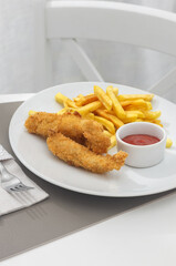 Fried Fish Sticks with French Fries. Fish Fingers. Fish Sticks with fried potato
