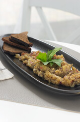 Eggplant caviar in plate. Vegan snack food