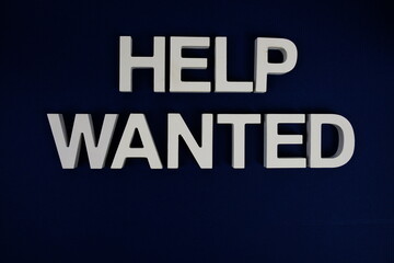 Help Wanted alphabet letters on blue background