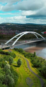 Newport City, Wales River Usk, City bridge, M48 road and surrounding residential areas of the city | Summer time | panoramic video from a drone | vertival, 4k