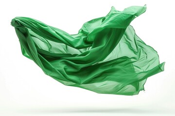 A green cloth floats through the air with a gentle motion
