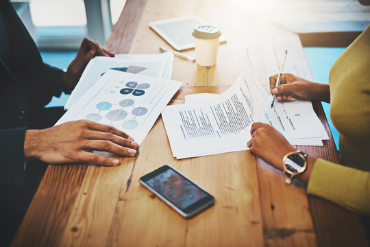 Business hands, documents and signature in meeting for contract, terms and conditions with project agreement. Startup team, people or b2b clients with negotiation, partnership or onboarding paperwork