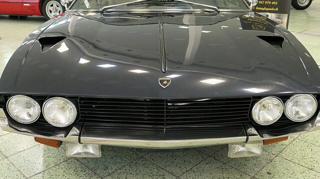 Front mask of four seat italian grand touring coupe car Lamborhini Espada from year 1968, black color, displaye on car and tuning show in Nitra, Slovakia, june 2024
