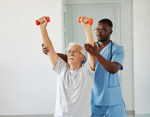 therapist senior home exercise exercising patient physical therapy care nurse recovery dumbbell...