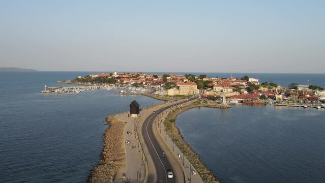 Bridge to Old Town of Nessebar, windmill and lanterns, road, landscape Beautiful historical town Nessebar in Bulgaria. Drone view