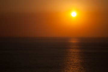Evening sunset on the horizon into the sea.