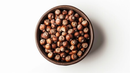 Fototapeta premium A wooden bowl filled with nuts on a white surface