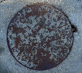 Vintage retro metal manhole cover with unusual pattern