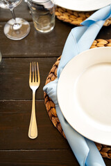 Wedding Tablescape with White Baby Breath Flowers, Blue napkins, and Boho theme