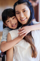 Mom, girl and portrait in home with hug for bonding, support and relationship together as Asian family. Mother, daughter and face in living room with smile, trust and care for love, relax and weekend