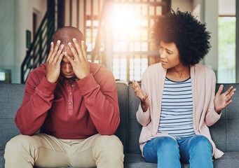 Man, woman and argument with fight on sofa with depression, headache and frustrated for divorce in...