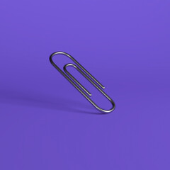 Silver Paper Clip on Purple Background