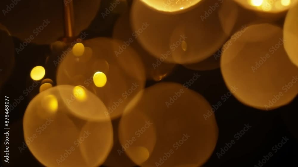 Poster on a black background, blurred bokeh circles appear, creating a dreamy and abstract effect.