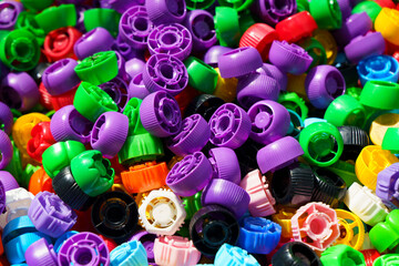 Plastic lids. Lots of colorful caps. Industry, ecology, plastic processing