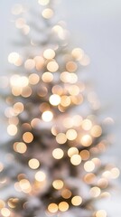 Obraz premium Blurred light background, Christmas tree with golden lights. Christmas and New Year festive concept. Template for greeting card, invitation, banner with copy space.