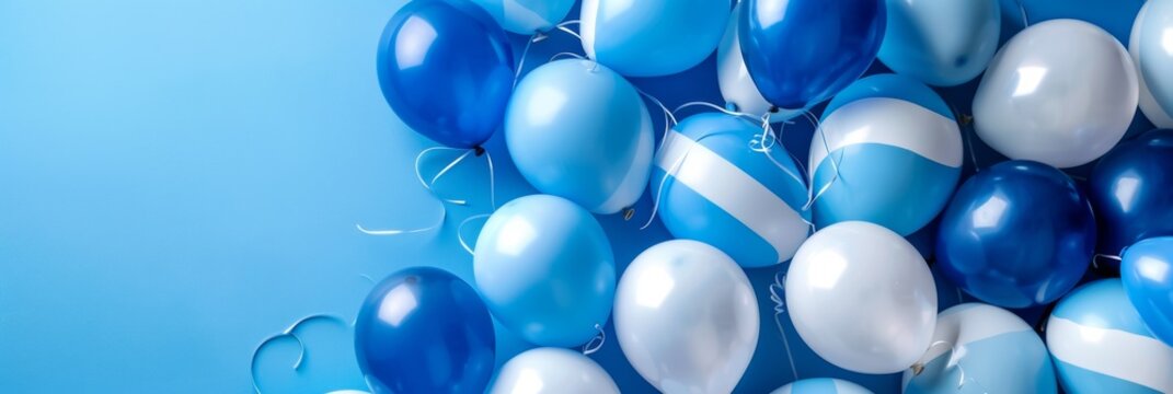 Uruguay Independence Day. Horizontal banner. Balloons in the colors of the Uruguayan flag, white and blue balloons on a blue background. Free space for text, copy space