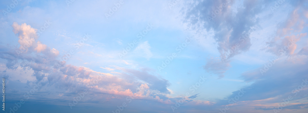 Poster a clear blue sky with a few clouds. the sky is very bright and the clouds are scattered throughout