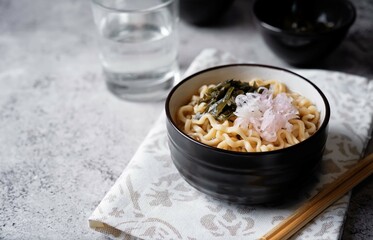Ramen noodles with seaweed and radish in a bowl
