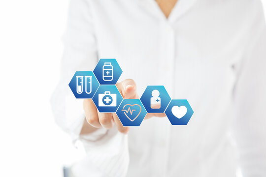 Medical doctor touching icons of healthcare services on digital screen.