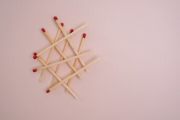 Box with new matchsticks on color background. Scattered wooden matches without a box close-up. Design
