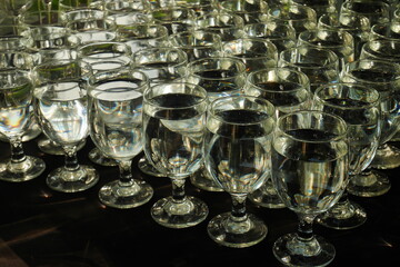 Arrangement of transparent glasses mineral water with a low key mood.