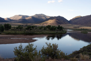 The Green River, a sand bar, and landscape at dawn in Browns Park National Wildlife Refuge in Colorado