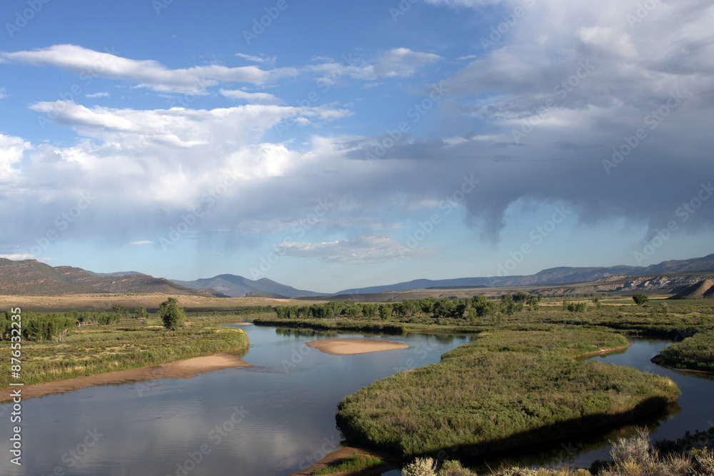 Poster The Green River and riparian landscape with sand bars and dry rain overhead at Browns Park National Wildlife Refuge in Colorado