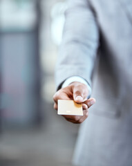 Businessman, hand and offer with credit card for payment, banking or transaction at office. Closeup of man or employee with debit for purchase, buying or atm chip for tap or insert at workplace