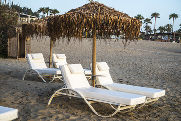 Olympia Riviera beach sunbeds close up
