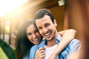 Fototapeta premium Smile, couple and portrait in hug for selfie outdoor of house, apartment and memory with joy. Man, woman and photography by home for bonding with affection, embrace for care and happy in picture