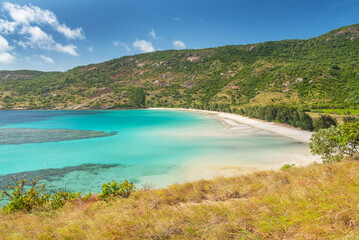 Obraz premium Picturesque tropical sandy Watsons Beach with turquoise water on Lizard Island, Australia. Lizard Island &nbsp;is located on Great Barrier Reef in north-east part of Queensland