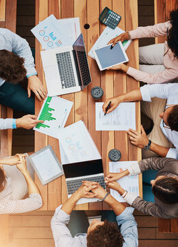 Data, analytics and hands of business people at workshop for planning, strategy and stats for tech sales growth. Laptop, paperwork and team in meeting with charts, graphs and collaboration from above