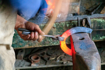 Europe, Romania. Viscri. Local Gypsy blacksmith.