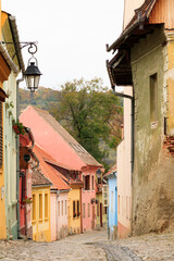 Europe, Romania. Mures County, Sighisoara. Cobbled street.