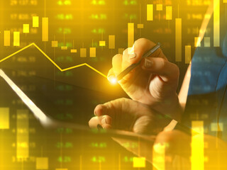 Financial background. Investor draws charts on virtual screen. Hand of economic analyst. Golden trading backdrop. Financial mathematical analysis. Trading process. Investment analysis of securities