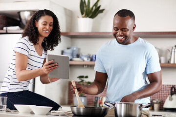 Home, kitchen and happy couple with tablet for cooking, recipe web and instructions of food dish....