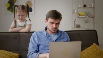 Frustrated Father Continues to Work as Daughter Seeks Attention at Home