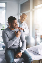 Elderly doctor, man and patient with shoulder pain for physical therapy, healthcare or body...
