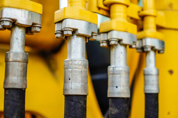close-up view of nozzle hose attached with reinforcing bolts.hydraulics pipes and nozzles, tractors...