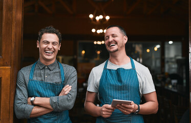 Team, restaurant and men with tablet or online, professional and people for small business startup. Laughing, portrait and pride for success in career in hospitality service, growth and together.