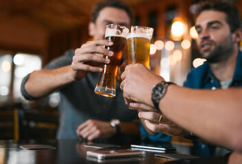 Glasses, men and beer in pub with drinks as celebration for cheers, happiness or social bonding. Alcohol, friends and people in restaurant for birthday party, event and reunion in Germany with toast