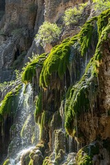 Glittering crystals cascading down a moss-covered cliff face, Generative AI